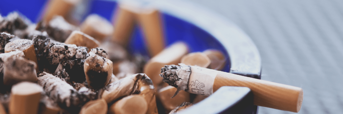 Tobacco Cessation & Prevention Image of an ash tray with cigarette butts